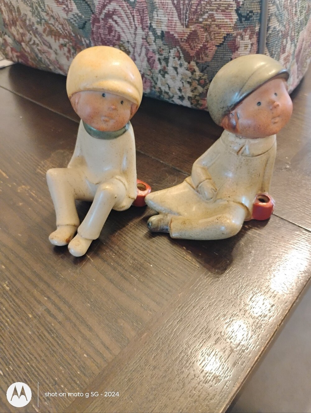 Pair of Ceramic Uctic  Sitting Boy Figurines in Cream and Peach